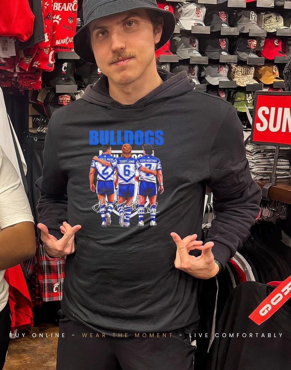 Canterbury-Bankstown Bulldogs players behind signatures shirt