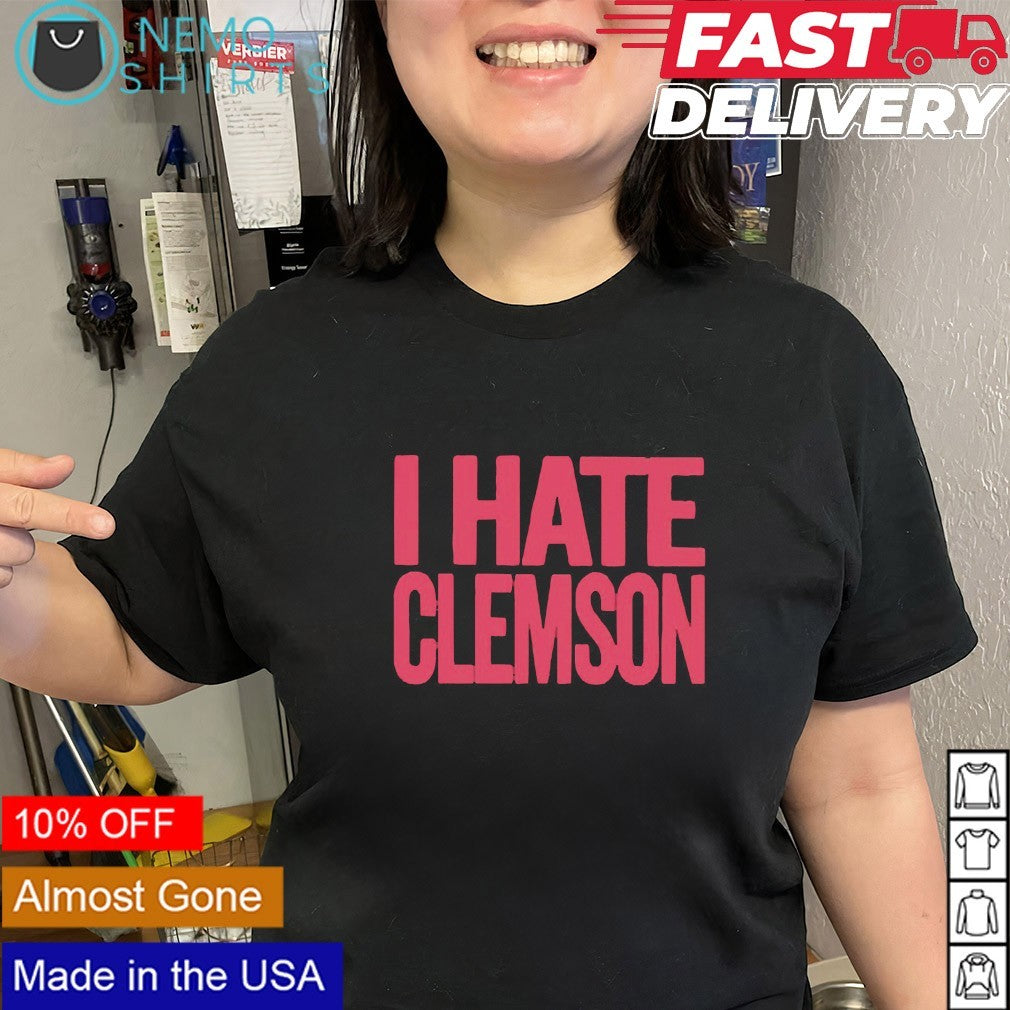 Greg Clark wearing I hate Clemson shirt