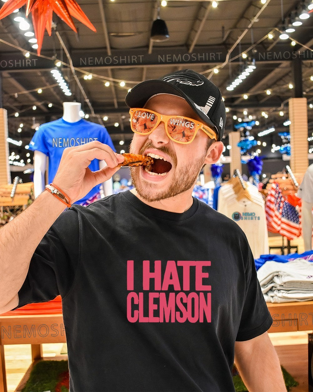 Greg Clark wearing I hate Clemson shirt