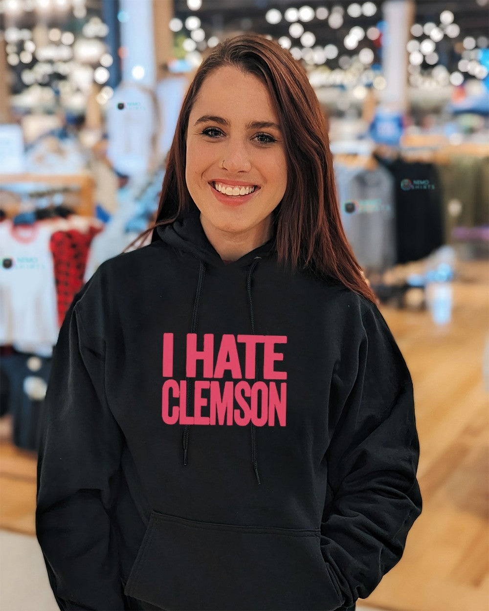 Greg Clark wearing I hate Clemson shirt