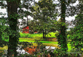 Red Barn Among The Trees Print