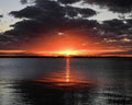 Red Sunset In Black Cloud At Melbourne Beach Park Florida Print