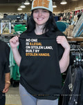 Black woman wearing no one is Illegal on stolen land built by stolen hands shirt