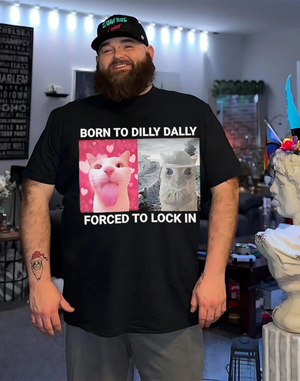 Cat born to dilly dally forced to lock in shirt