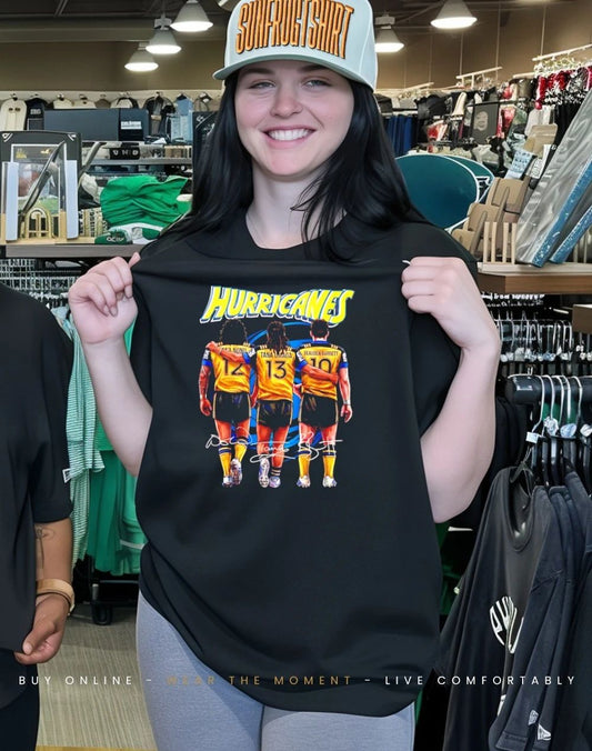 Hurricanes Rugby Union players behind signatures shirt