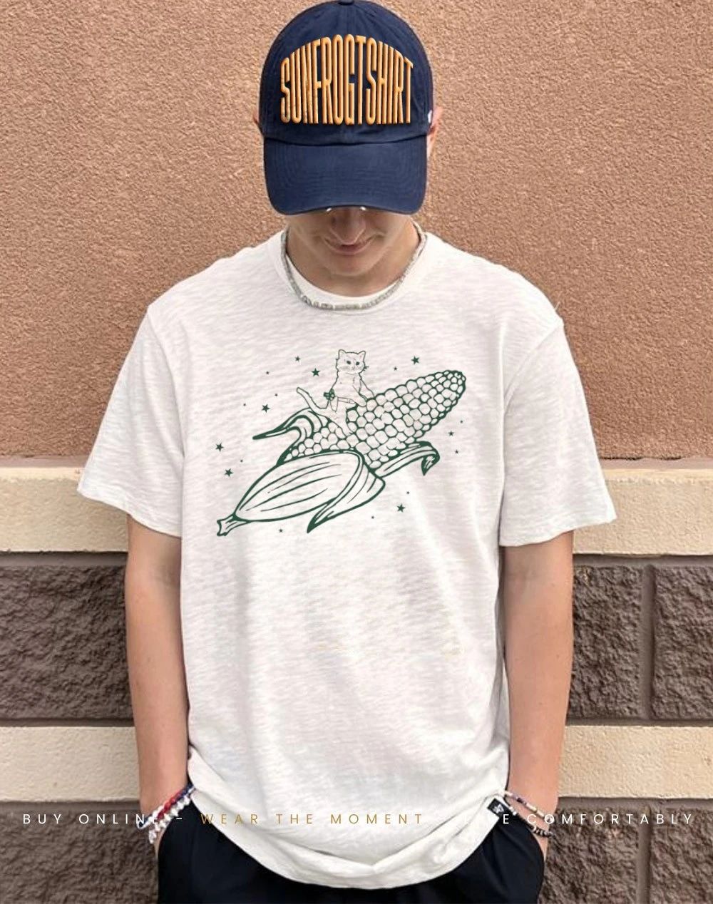 Gary the cat riding an ear of corn through the cosmos shirt