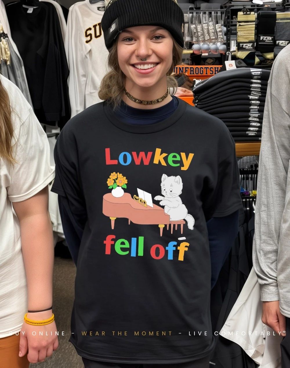Kitten playing piano low key fell off shirt