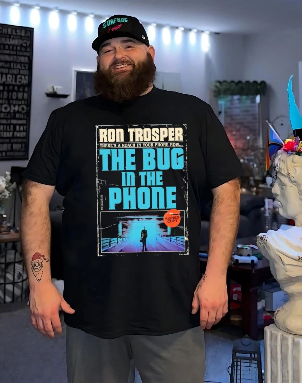 Ron Trosper there’s a roach in your phone now the bug in the phone shirt
